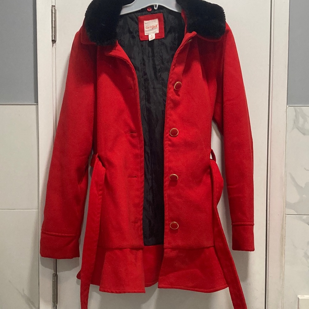 Red kid’s coat with removable fake fur neckline.